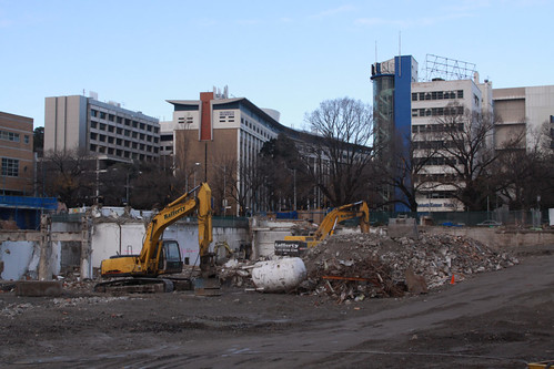 A big hole where the hospital used to be, excavators having cleared the site