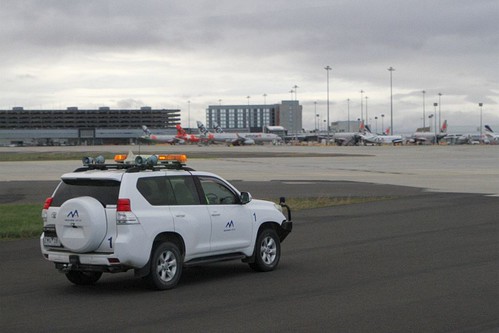 Melbourne Airport airside safety car waiting to lead our bus out to the next photo spot airside