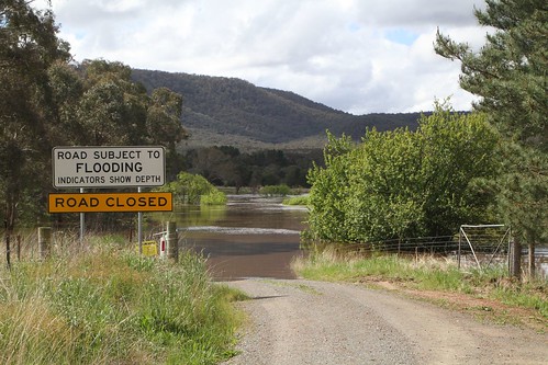'Road closed at Wollondilly River - detour via Hume Highway' sign on Mills Road at Towrang