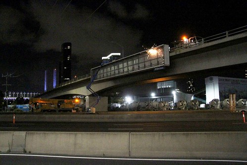Cutting away the billboard on the Ingles Street bridge over the West Gate Freeway at Port Melbourne