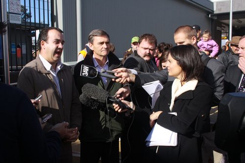 Taking questions from the media