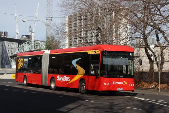 SkyBus articulated bus #74 rego 7487AO departs the bus-only road at Southern Cross Station