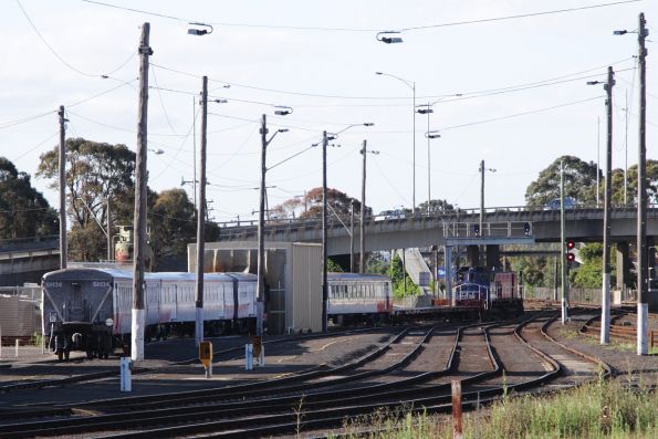 Y156 shunts a carriage set through the train wash at Geelong