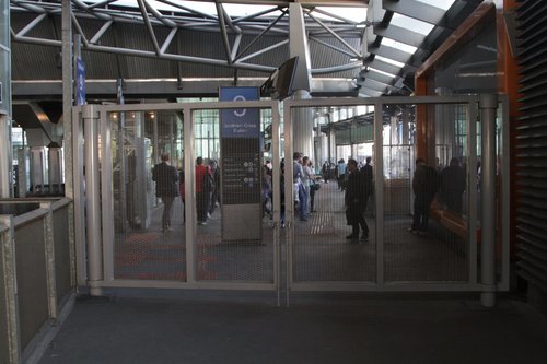 Steel gates block access between the V/Line paid area and the suburban paid area at the Bourke Street end