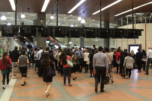 Queues form behind the underperforming myki gates at Flagstaff station
