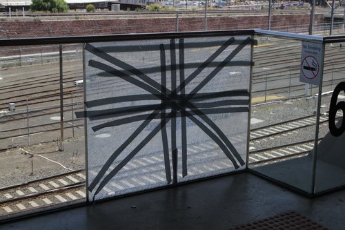 Cracked glass balustrade at North Melbourne station