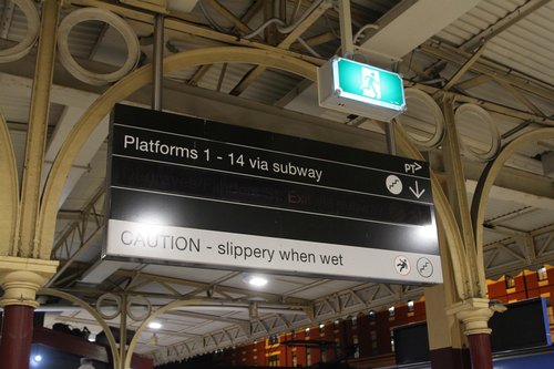 Illuminated 'Degraves/Flinders Street Exit via subway' sign switched off at platform 6 and 7