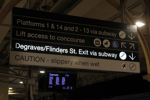 Illuminated 'Degraves/Flinders Street Exit via subway' sign switched on at platform 8 and 9